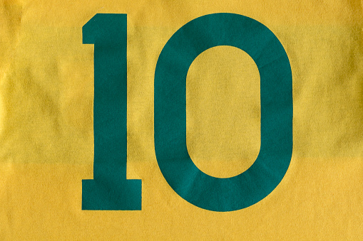 Number 10 in green with a yellow fabric background. Brazil colors. Shirt 10, football player.