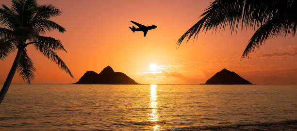 Aerial view through the window of an airplane to the Napali Coast in Kauai, Hawaii