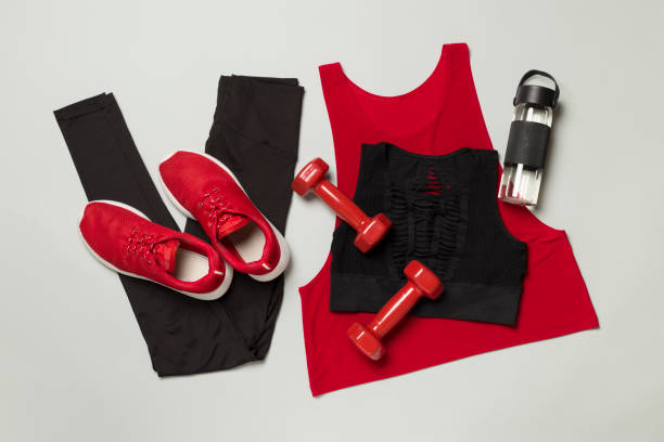 istock Black gym outfit on color background, top view 1478469144