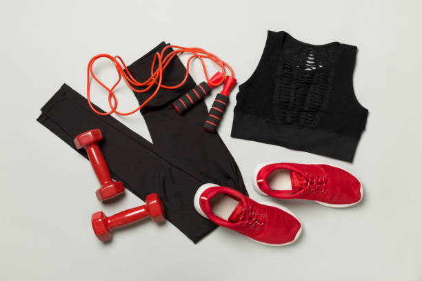 istock Black gym outfit on color background, top view 1478469165