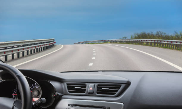 istock View from the windshield of a car driving along road 1478469689