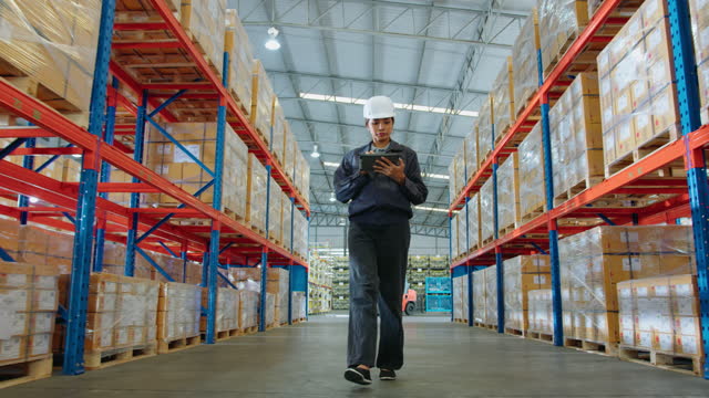 Female warehouse worker Inspector Checking check merchandise package Inventory. Storehouse Logistics and Delivery Center