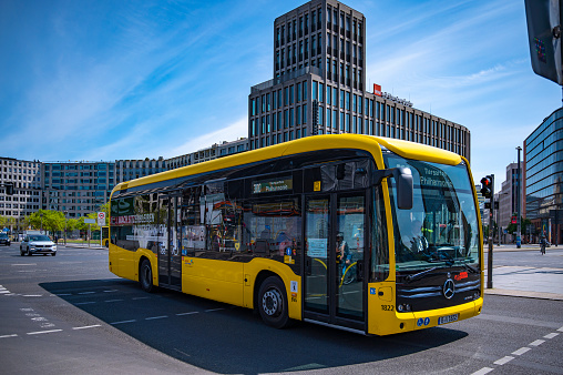 Berlin, Germany - May 8, 2020: Street scene with a public transport bus at Potsdamer Platz in downtown Berlin.