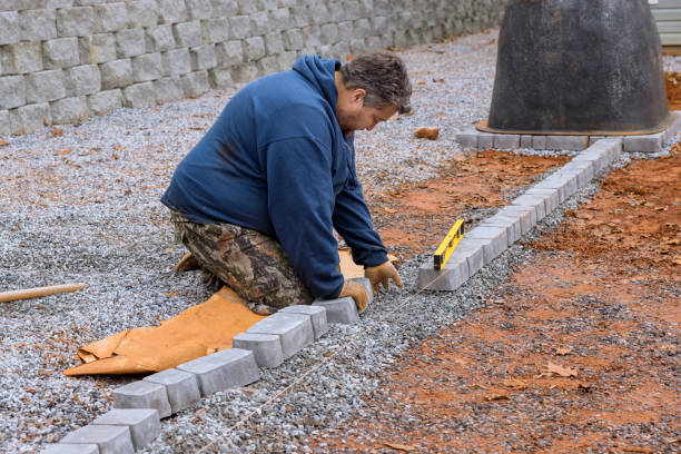istock The pavers stone pathway paving, the master lays paving stones by using a professional paver worker to lay the paving stones. 1478481321