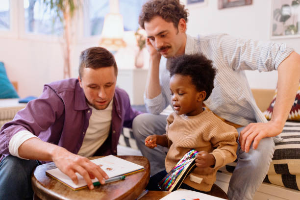 istock Caring gay couple spending time with their adopted child 1478485463