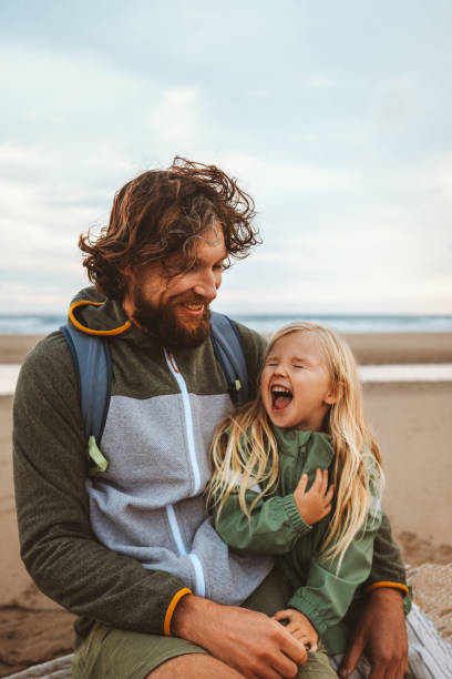 Family father with child outdoor dad with daughter happy laughing face vacations lifestyle together candid emotions stock photo