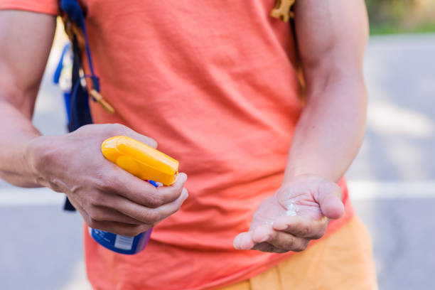 istock Sunblock bodycare lotion for summertime. Unrecognizable mid man closeup ultraviolet rays protection 1478498267