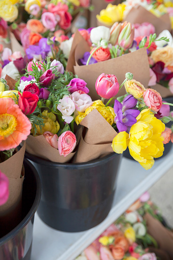 An assortment of colorful bunches of flowers for sale at a farmer's market