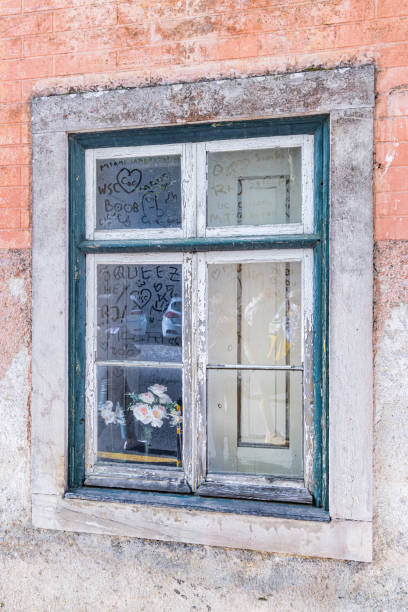 Europe, Portugal, Sintra. April 16, 2022. Grafitti written into the dust on a window in Sintra.