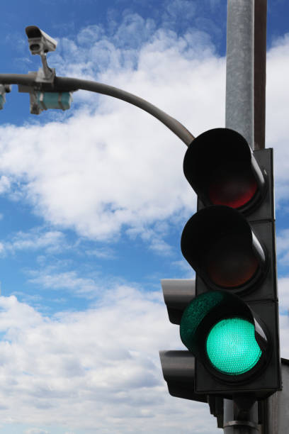 istock Modern traffic light in city against cloudy sky 1478509542