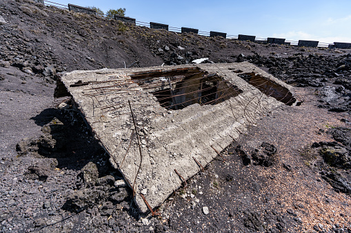 A house buried and destroyed by volcanic ash on the slopes of Mount Etna after its eruption.
