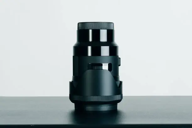 Photo of Close up and isolated shot of a camera lens 35mm