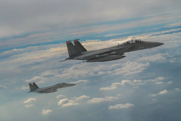 istock Jet aircrafts flying over the clouds. 1478511230