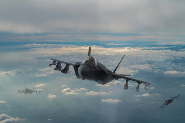 istock Jet aircrafts flying over the clouds. 1478514914