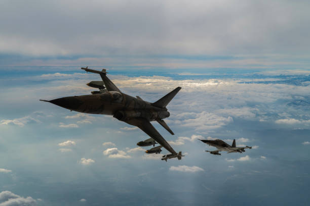 istock Jet aircrafts flying over the clouds. 1478515273
