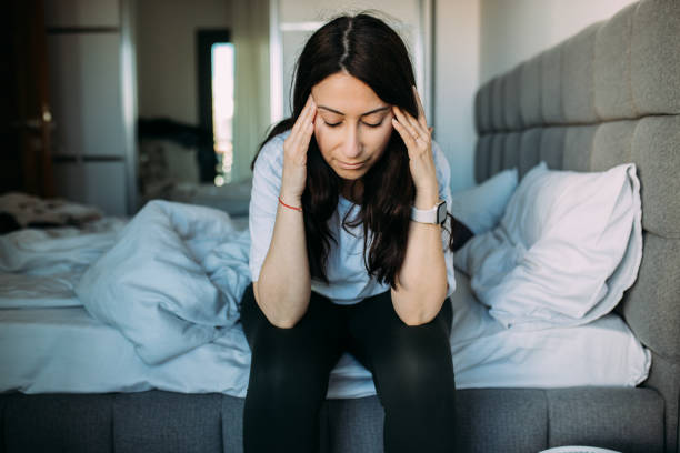 istock Woman having headache when wake up 1478515806