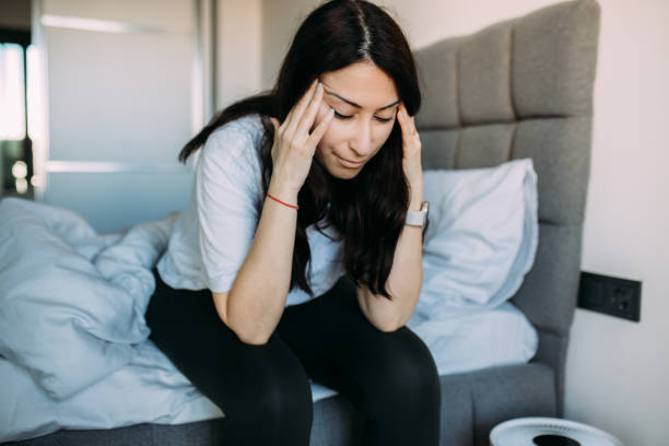 istock Woman having headache when wake up 1478515932