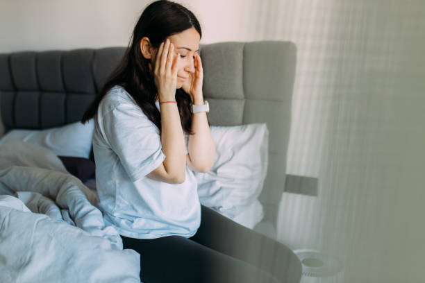 istock Woman having headache when wake up 1478516223