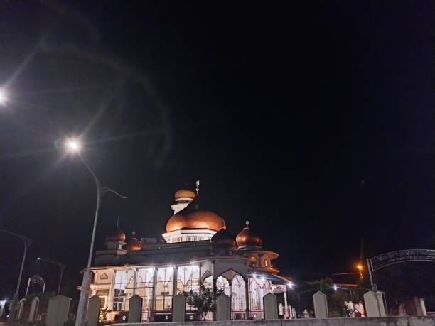 istock Beautiful Golden Mosque with Five Domes and One Tower at Night 1478522986