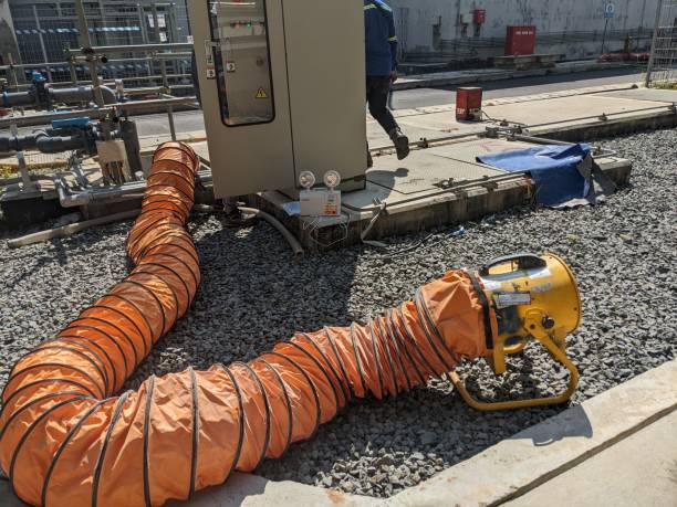 istock Working on confine space with blower and flexible hose for air circulation. 1478523166