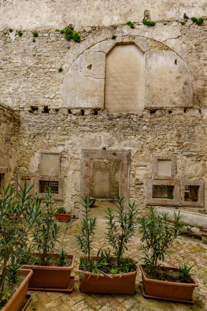 istock A small, modest backyard garden between old buildings. 1478524536