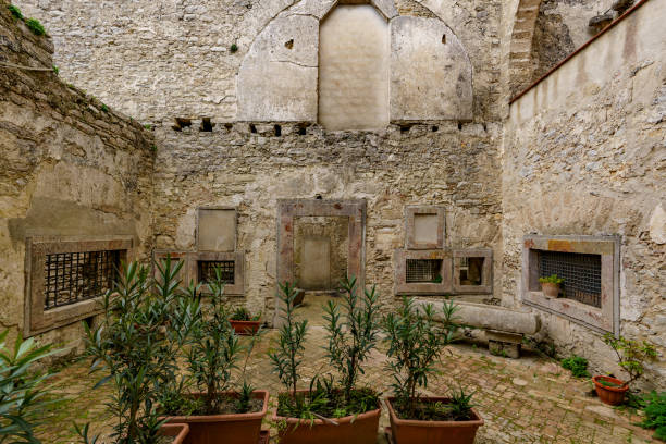 istock A small, modest backyard garden between old buildings. 1478524537