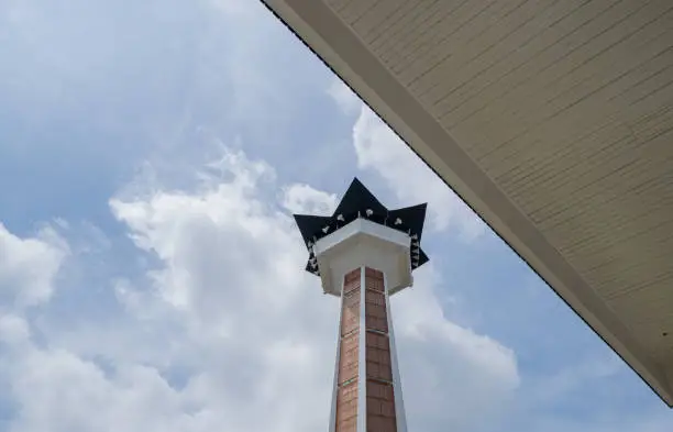 Photo of Main tower on Great agung mosque on the Semarang Central Java, when day time and blue sky.