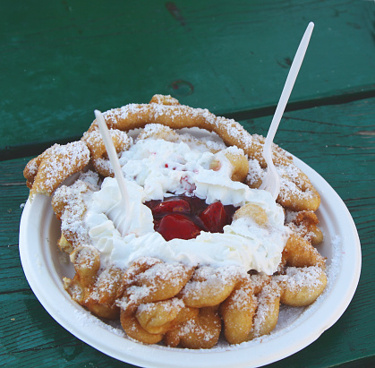 Close-up of a fresh funnel cake from the county fair ready to eat