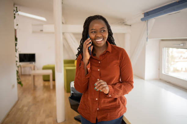 istock Happy young woman using phone 1478527584