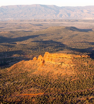 A lonely butte in the Arizona desert seen from the air