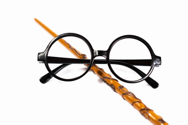 A man is looking up over his glasses frame.