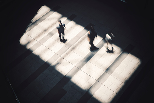 people walking on light and shadow