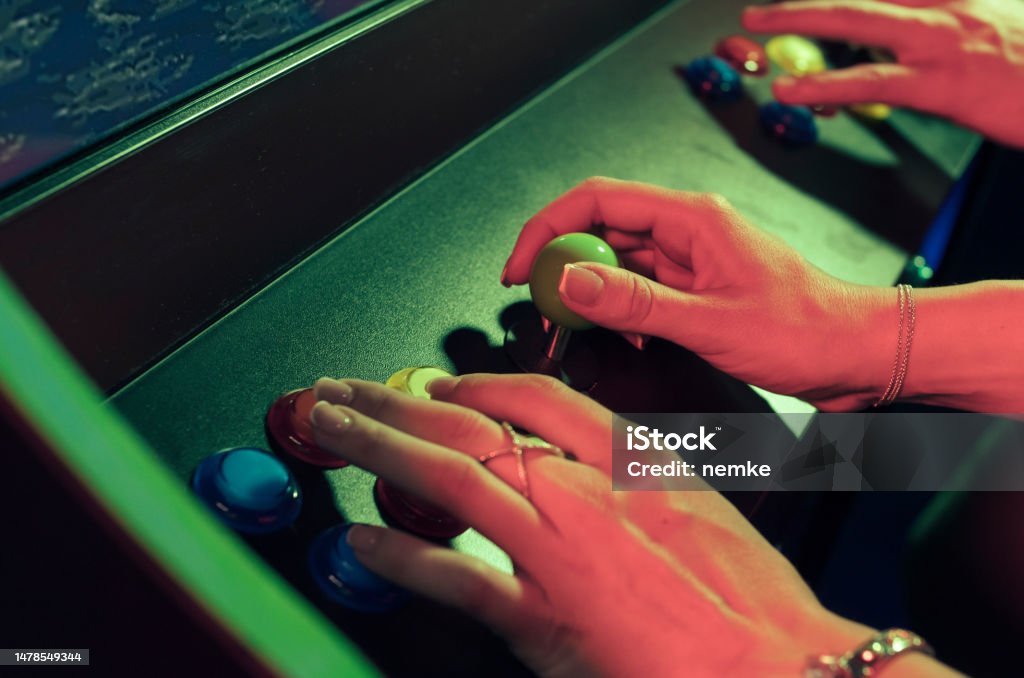 People playing an video game Amusement Arcade Stock Photo
