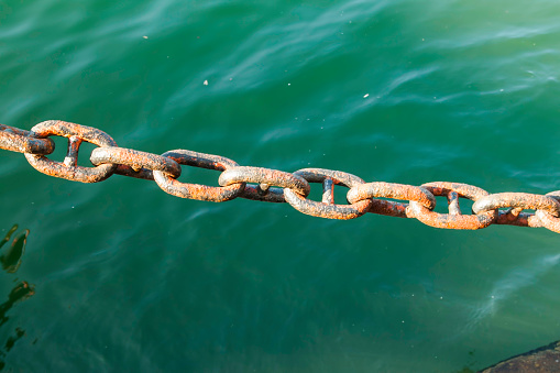 Anchor chain and blue water