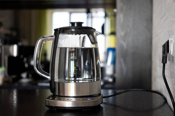 istock Transparent electric kettle with boiling water in the kitchen 1478557101