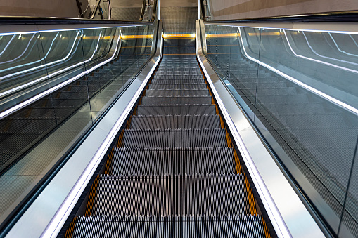 Modern luxury escalator with staircase without people. moving staircase