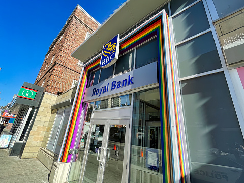toronto, canada - 24 October 2022: the entrance of a RBC royal bank office on church street with rainbow flag decorated