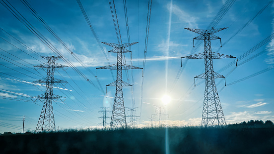 High-voltage wire tower at dusk