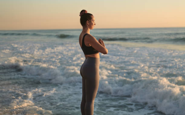 istock Female meditating in sea waves 1478559247