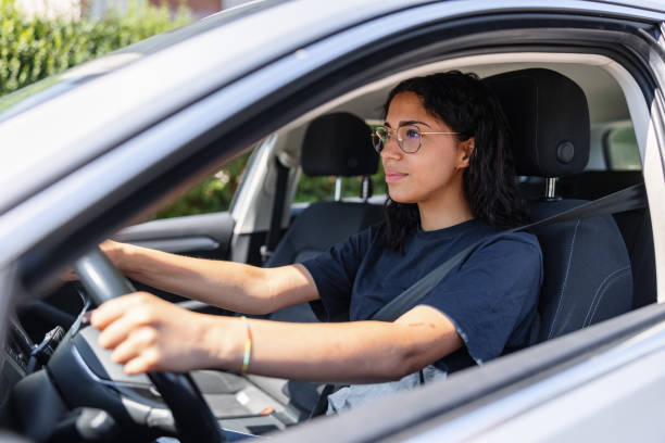 istock Young Latin Female Drives Casually Home From Work 1478561265
