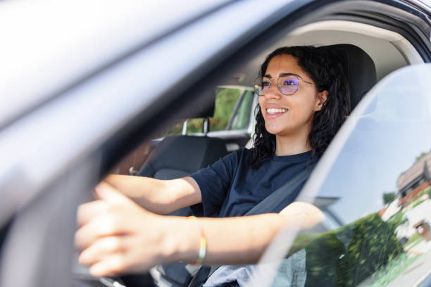 istock Young Hispanic Woman Looking On A Road While Driving. Using Glasses For Better Vision. 1478561267