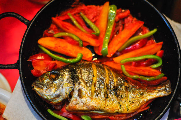 istock baked fish in cast iron with vegetables 1478566569