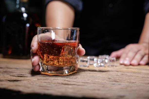 istock Barman pouring whiskey whiskey glass beautiful night 1478569565