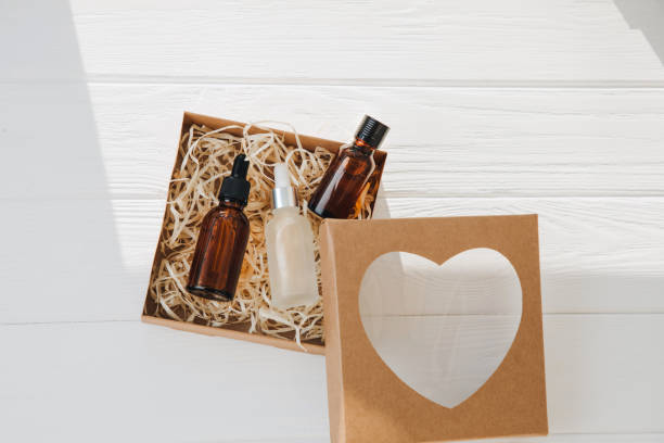 istock A gift in a cardboard eco package with cosmetics inside on a white wooden background 1478574065