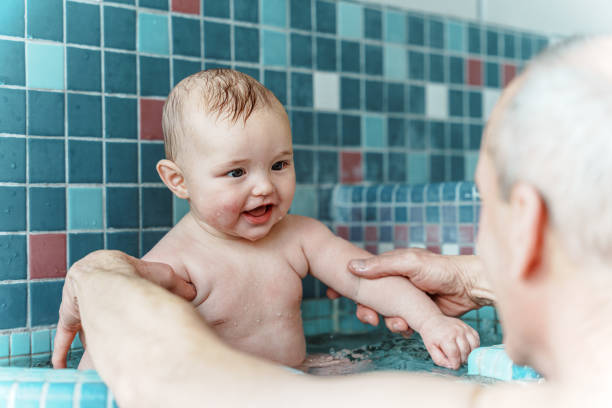 istock Happy baby boy swimming 1478574237