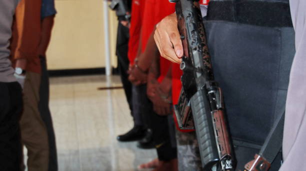 istock Police officer is holding with a rifle 1478579954