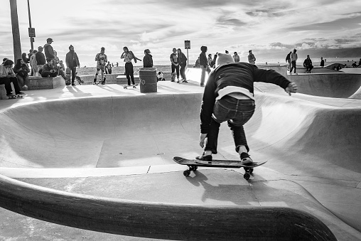 Venice Beach, California, United States - March 4 2019: A skater skating at Venice Skatepark.