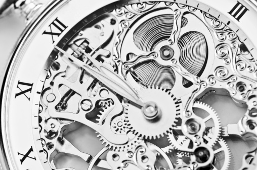 black and white close view of watch mechanism.