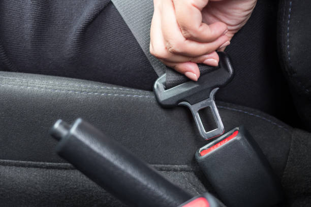 istock Woman fastens a seat belt. Safe driving concept 1478622098