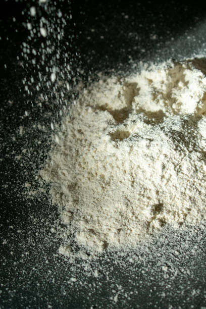 istock Abstract design of white flour cloud against black background 1478623312
